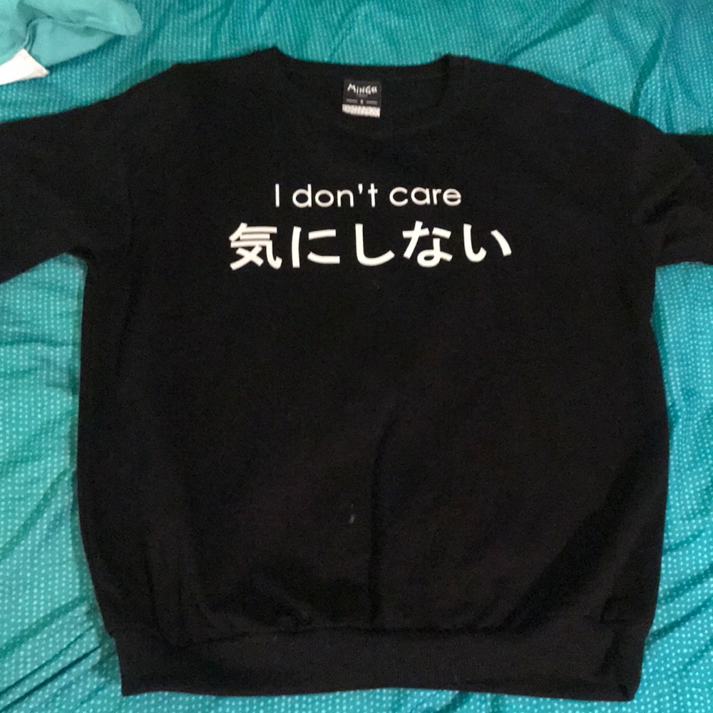 black minga pullover with white lettering